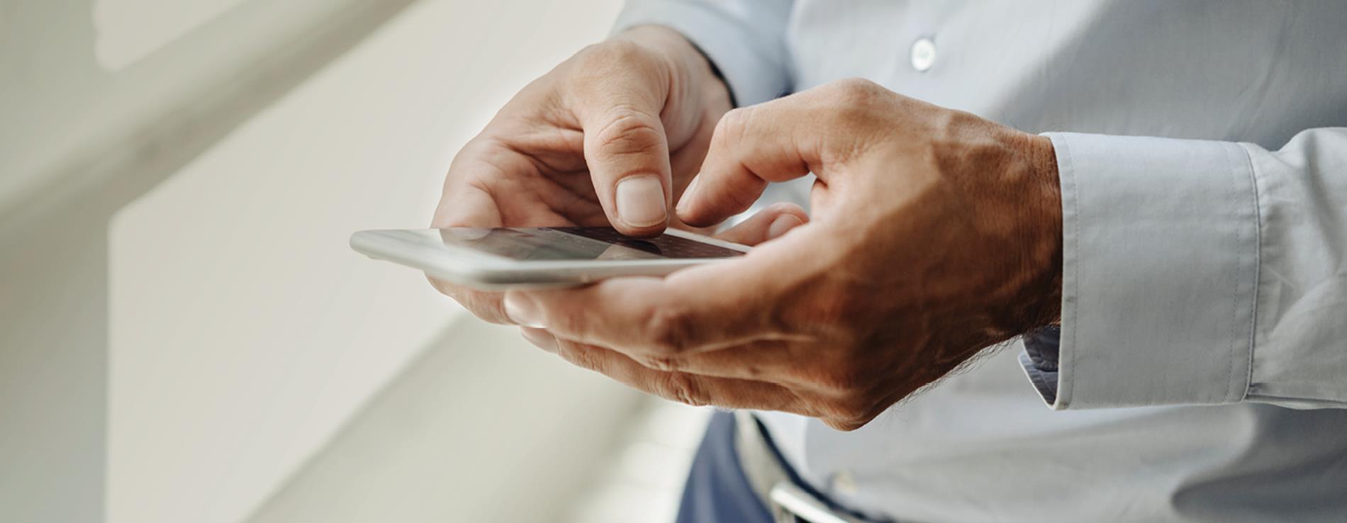 User on a laptop and mobile